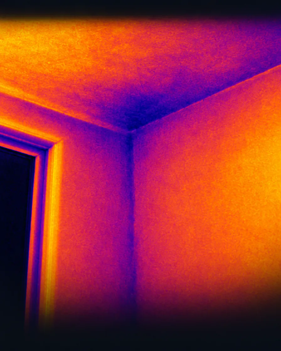 Thermal image of a room corner and a door